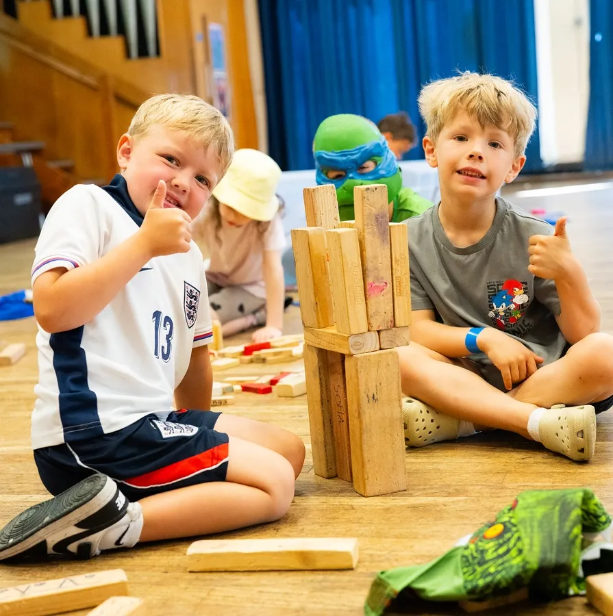 Children building with wooden blocks during Braintree Holiday Camp