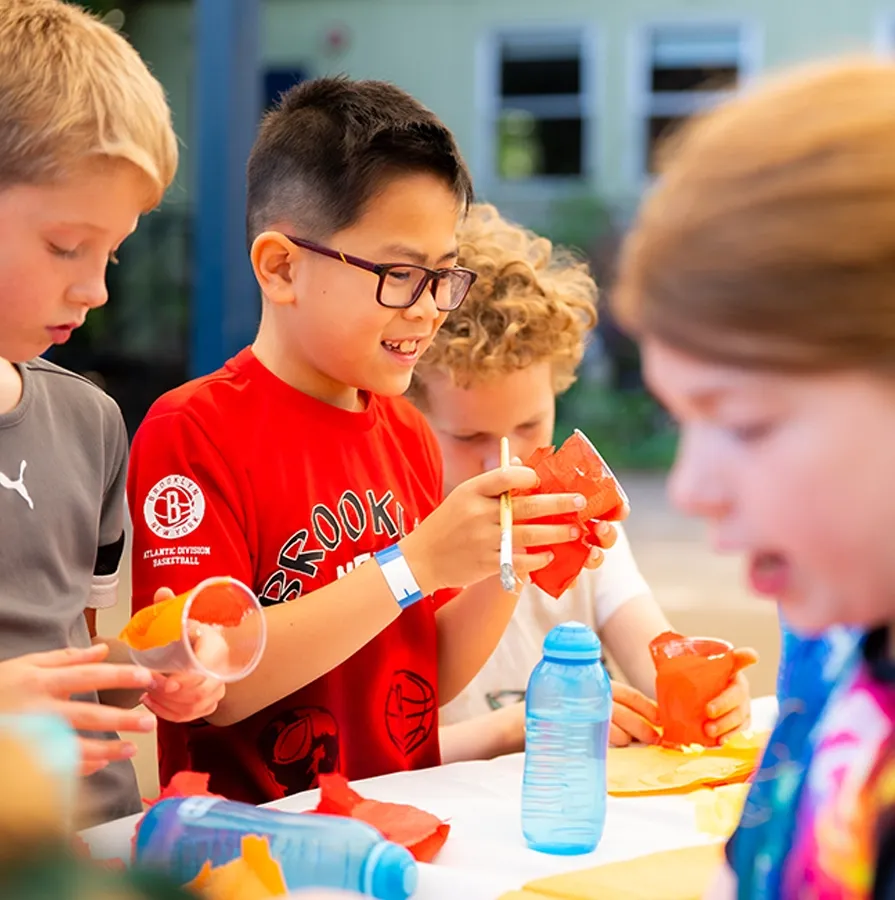 Children making crafts during Ockendon Holiday Camp