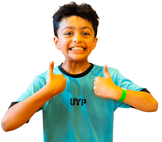 Smiling child giving thumbs up for Camp 4 Champs holiday camp